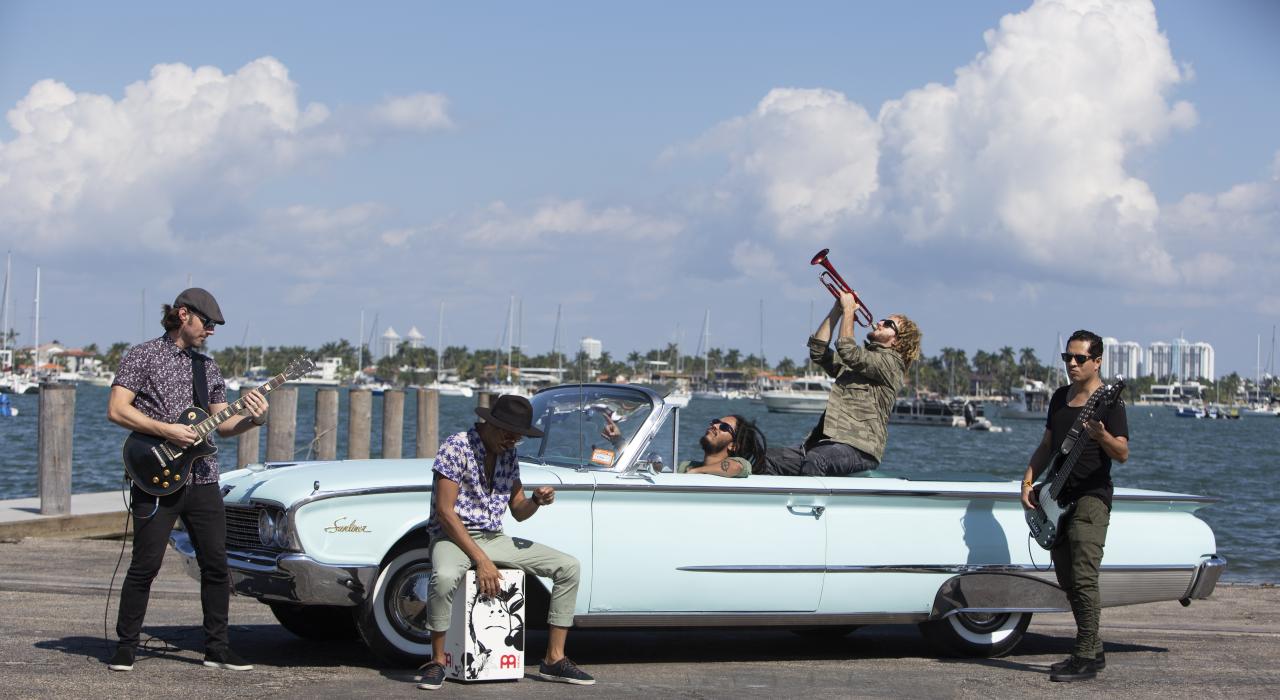 Xperimento, a multicultural and cross-genre band, posing on the waterfront in Miami, Florida