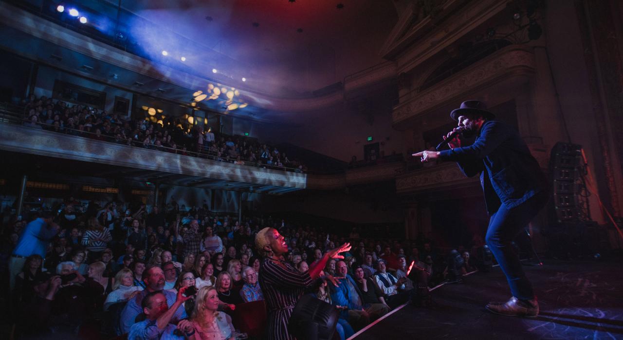 Singer-songwriter Erick Baker performing at the Bijou Theatre