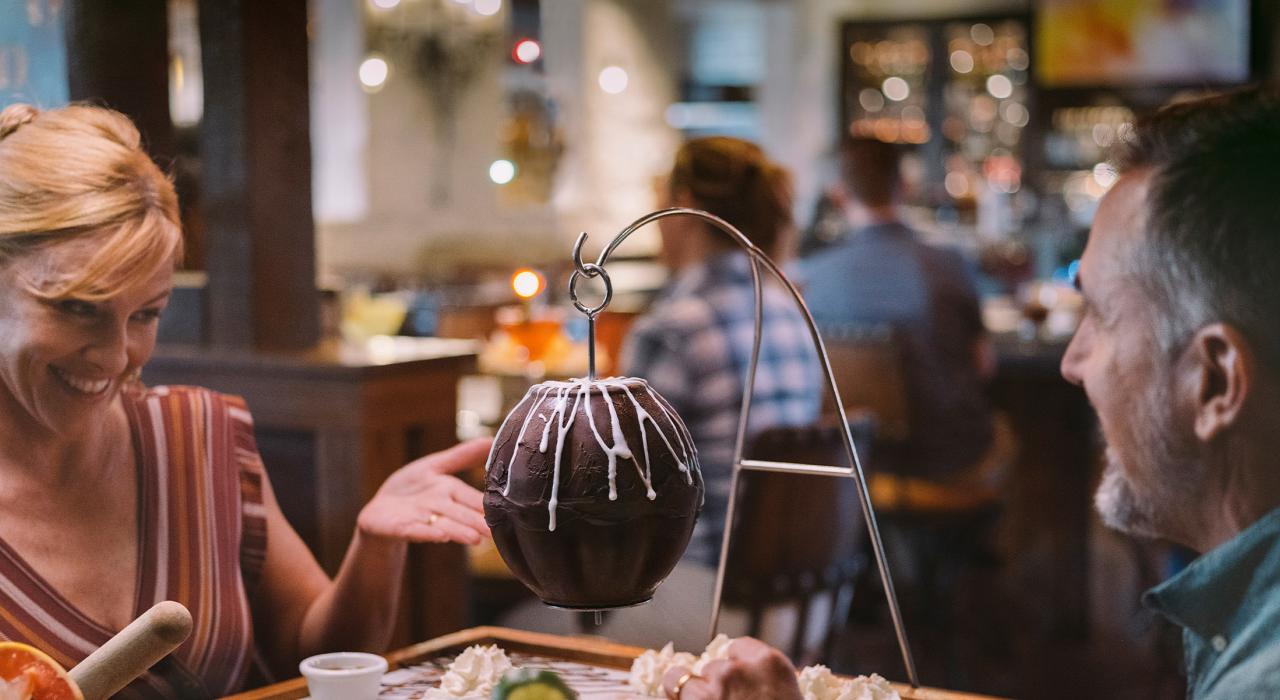 Sharing craft cocktails and a creative dessert at a local restaurant Sharing craft cocktails and a creative dessert at a local restaurant