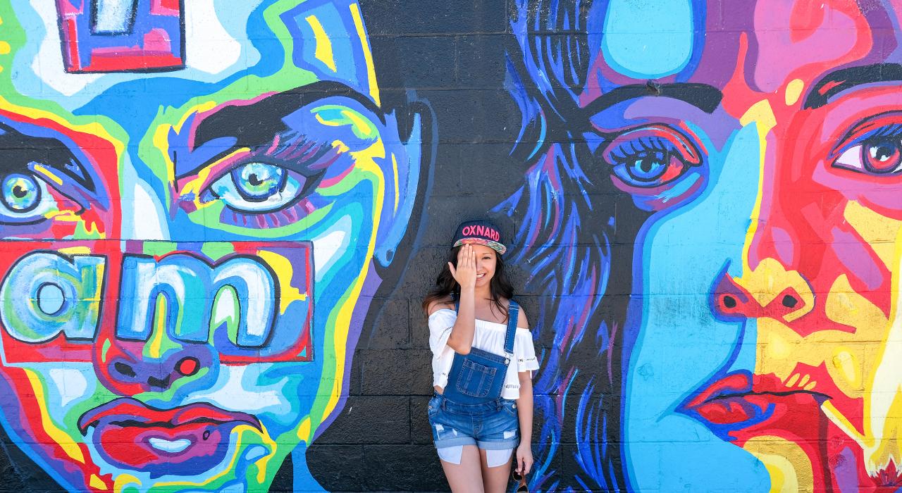 Posing with colorful mural art at Silver Strand State Beach