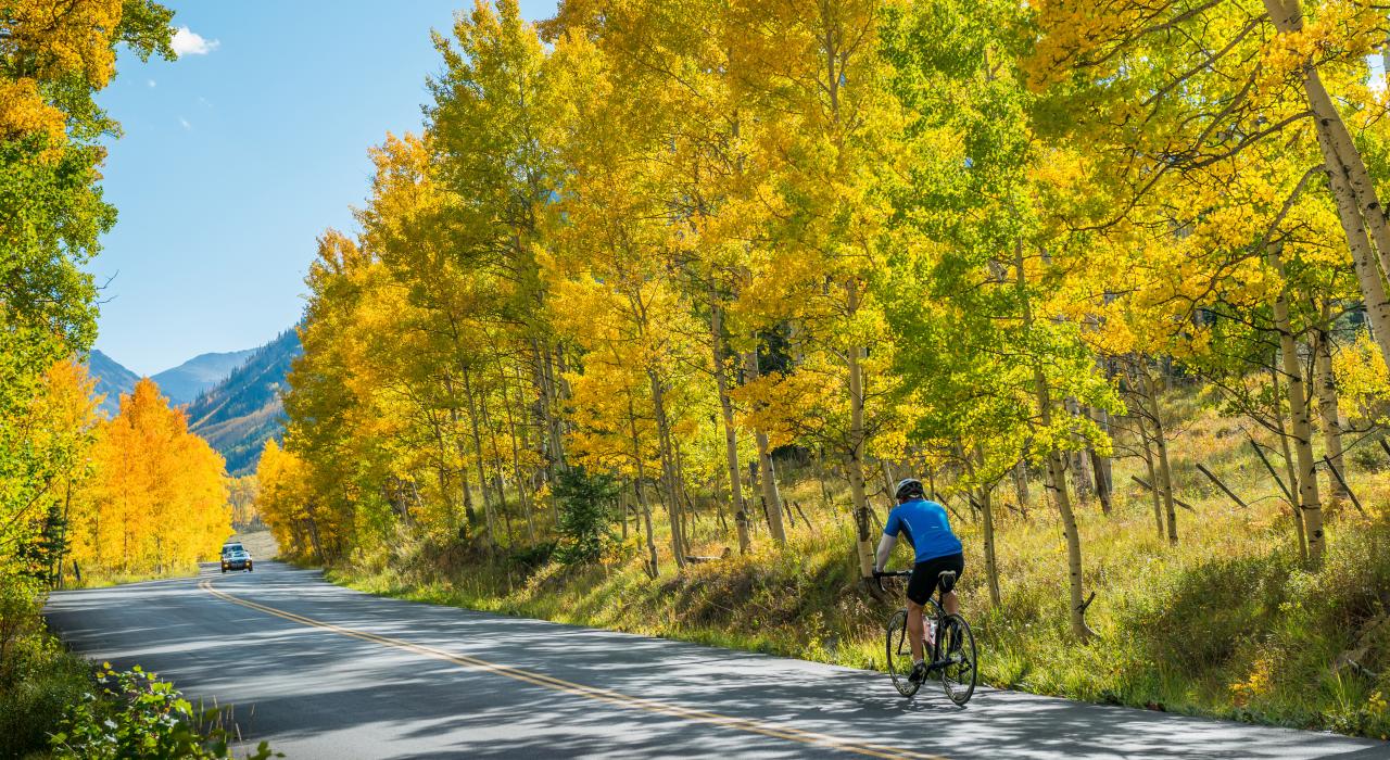 Biking along winding Castle Creek Road Biking along winding Castle Creek Road