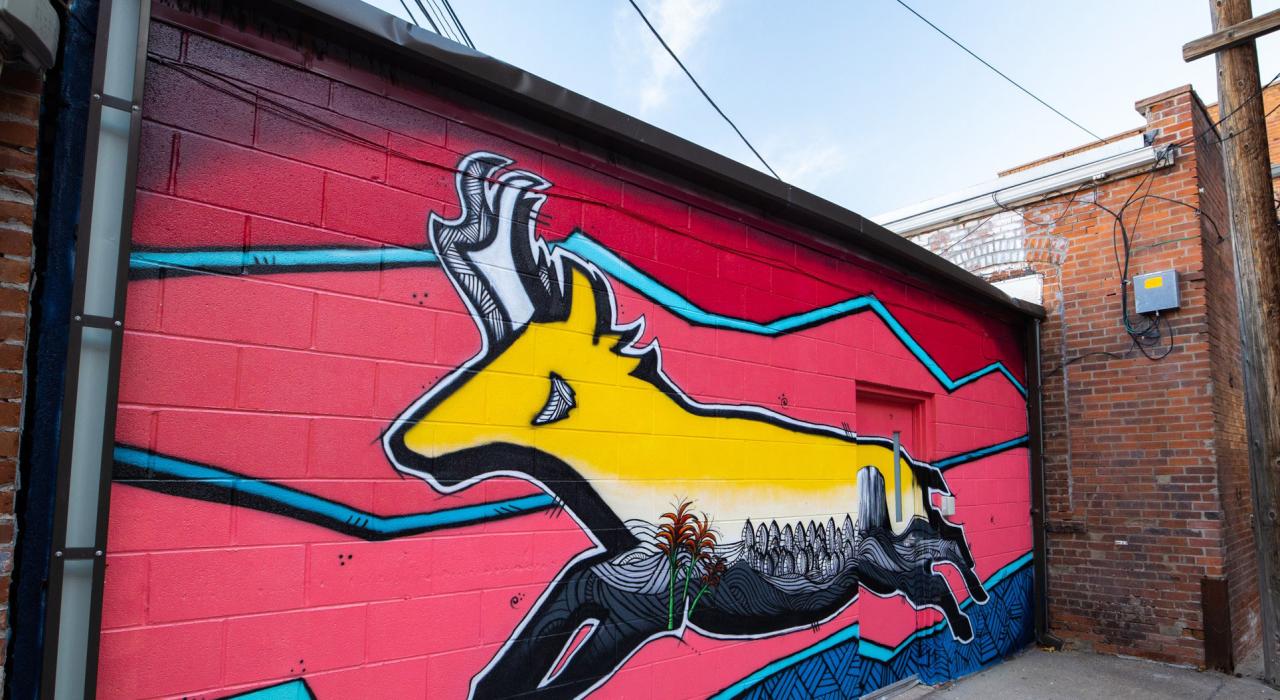 A colorful mural depicting a pronghorn antelope located downtown