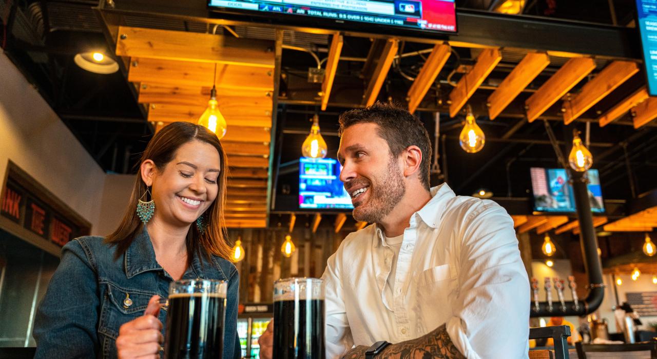Couple enjoying local craft beer at Black Tooth Brewing Company