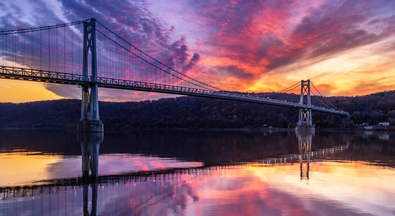 A dramatic sky behind the Walkway Over the Hudson in Poughkeepsie