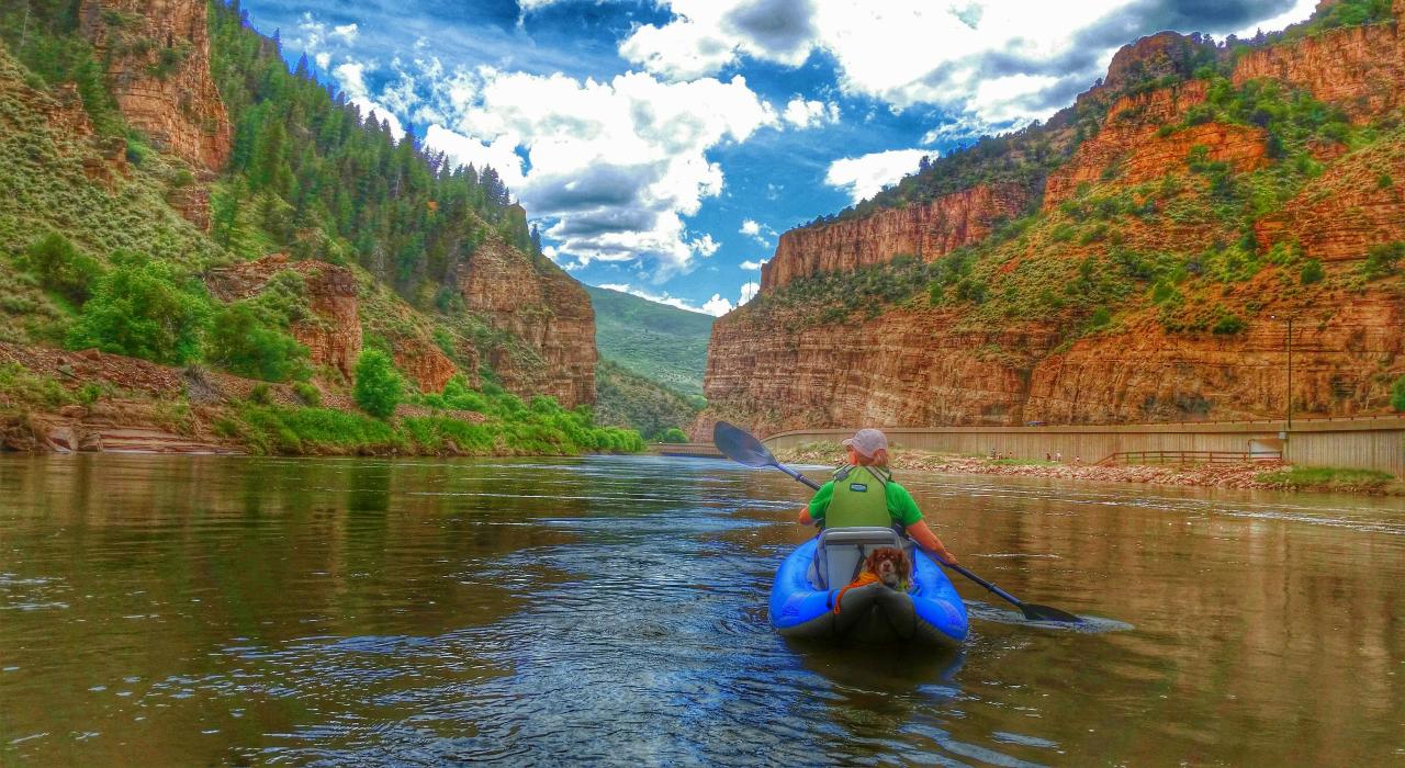 Kayaker paddling the Colorado River through Glenwood Canyon
