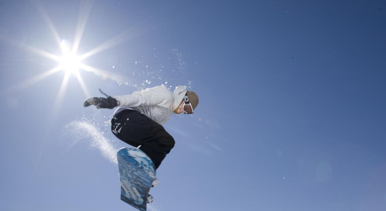 A snowboarder enjoys winter activities
