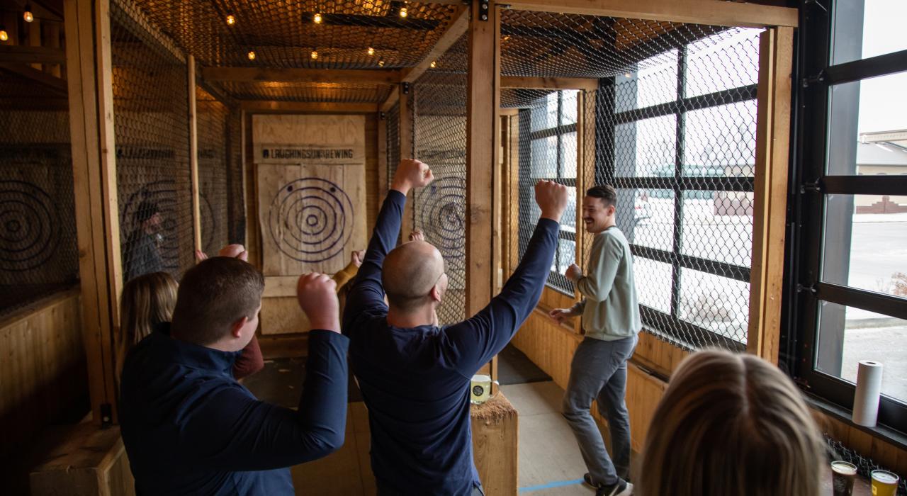 Enjoying recreational axe throwing at local taphouse Laughing Sun Brewing Co.  Enjoying recreational axe throwing at local taphouse Laughing Sun Brewing Co.