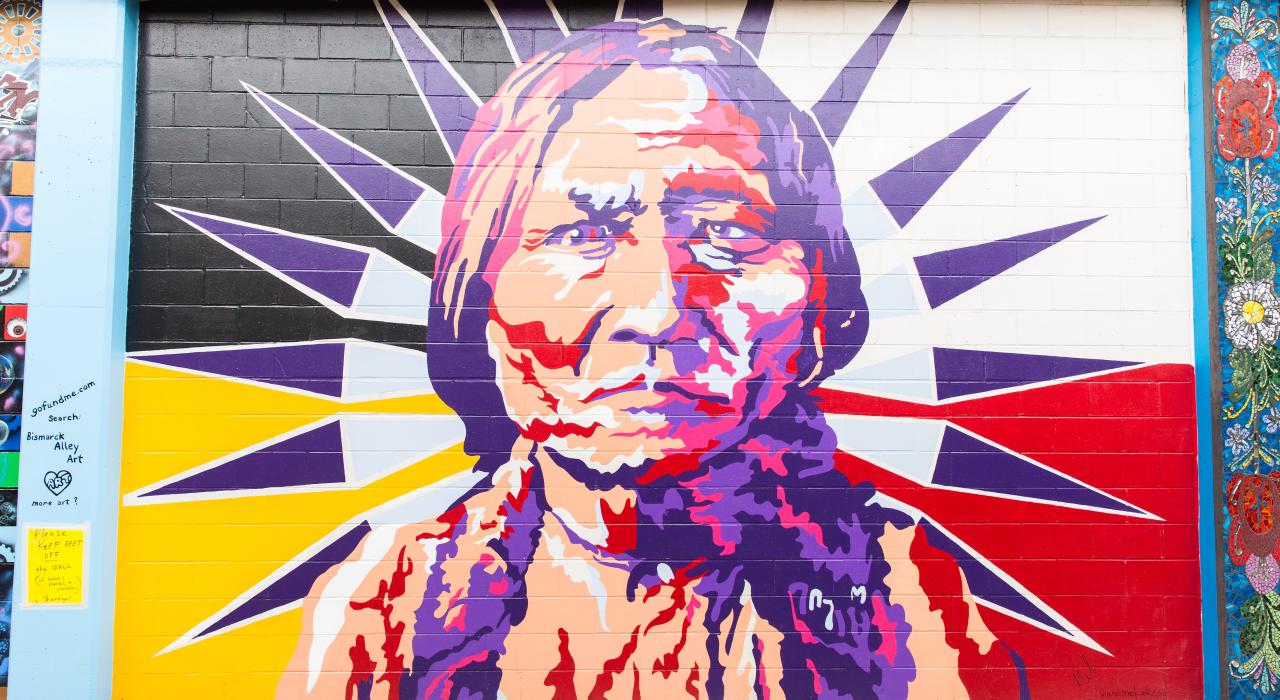 A colorful portrait of Lakota leader Sitting Bull by artist Melissa Gordon decorates Art Alley 5.5 in downtown Bismarck A colorful portrait of Lakota leader Sitting Bull by artist Melissa Gordon decorates Art Alley 5.5 in downtown Bismarck