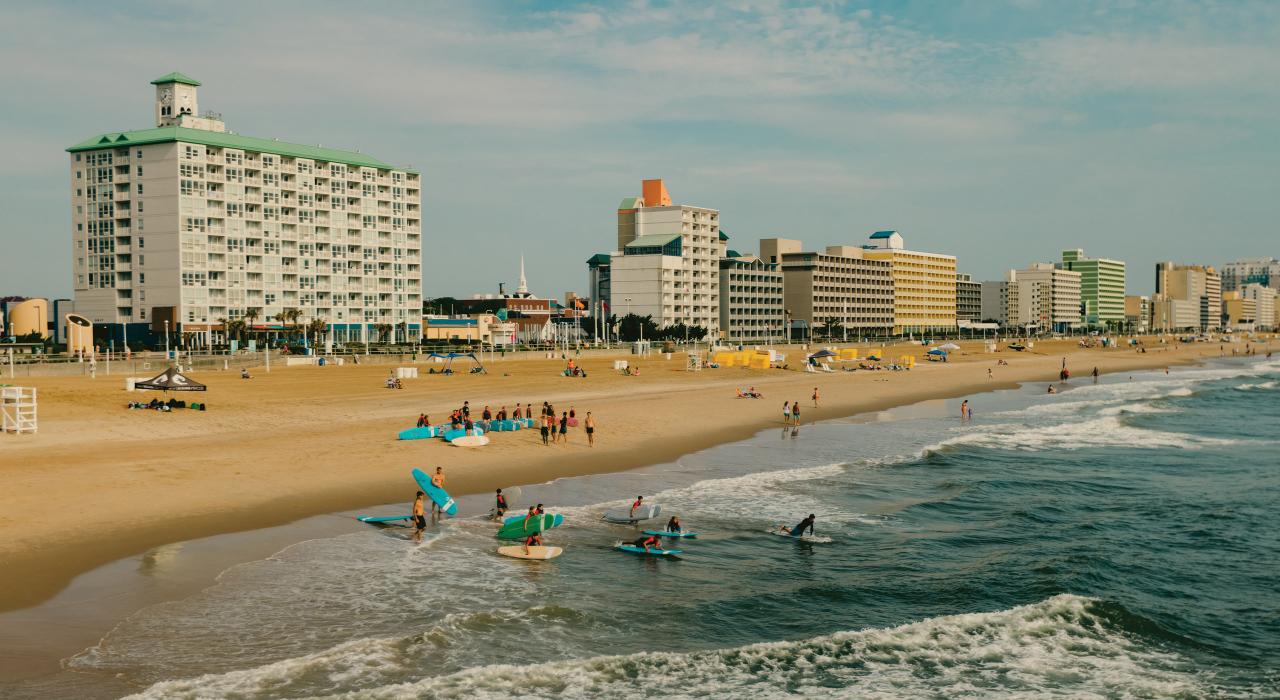 Surfers enjoy a beautiful day along the oceanfront Surfers enjoy a beautiful day along the oceanfront