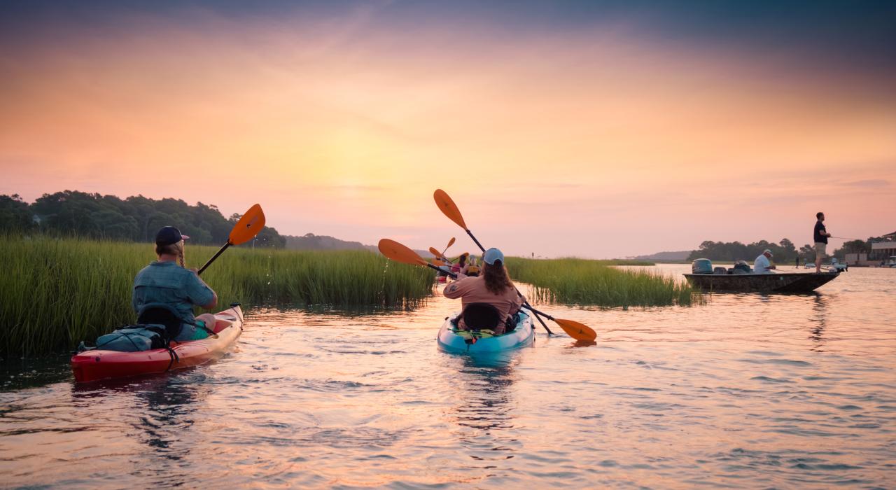 Kayaking through the marsh at sunset