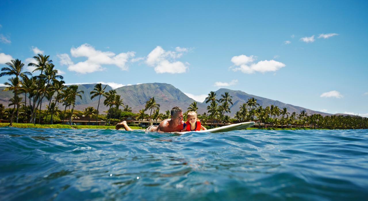 Family surfing in Maui, Hawaii