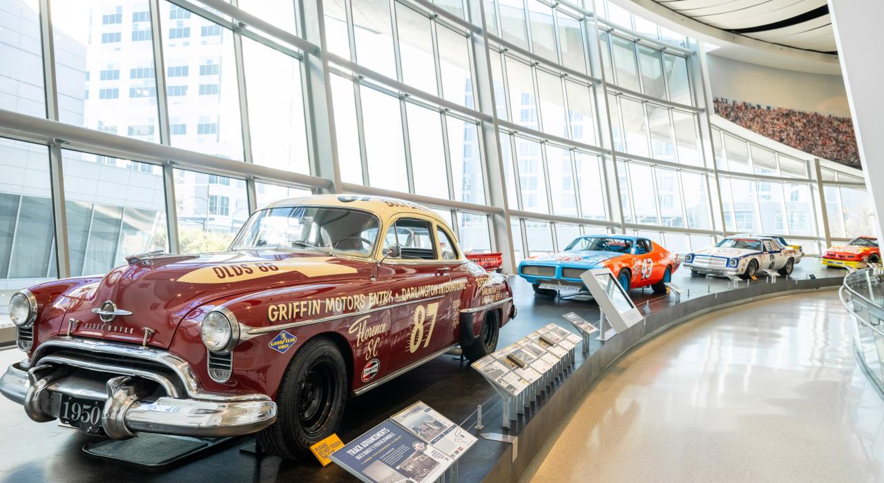 Historic race cars stand on display at the NASCAR Hall of Fame Historic race cars stand on display at the NASCAR Hall of Fame