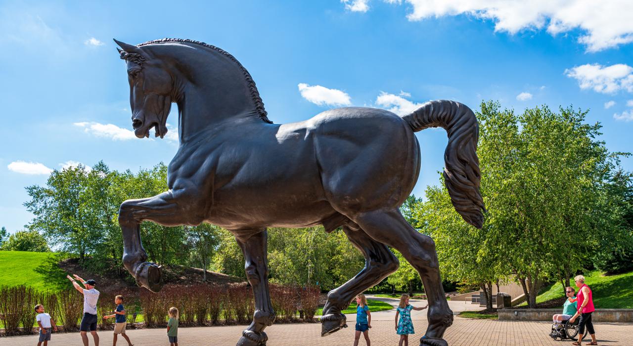 A sculpture titled The American Horse by artist Nina Akamu welcomes visitors to Meijer Gardens & Sculpture Park