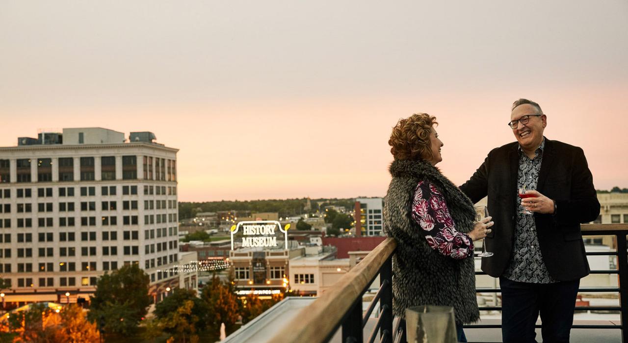 Enjoying drinks and city views at sunset at Vantage Rooftop Lounge and Conservatory