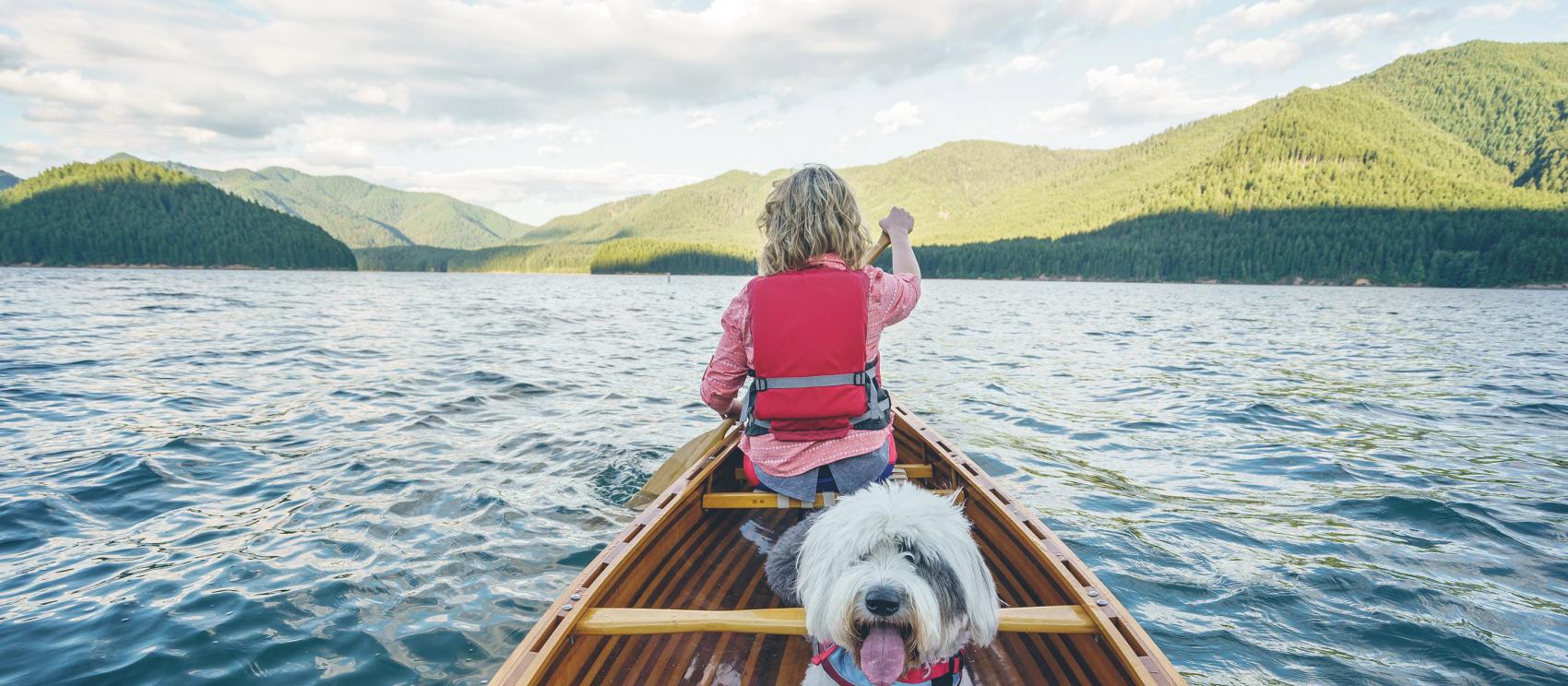 Canoeing on Detroit Lake surrounded by lush peaks