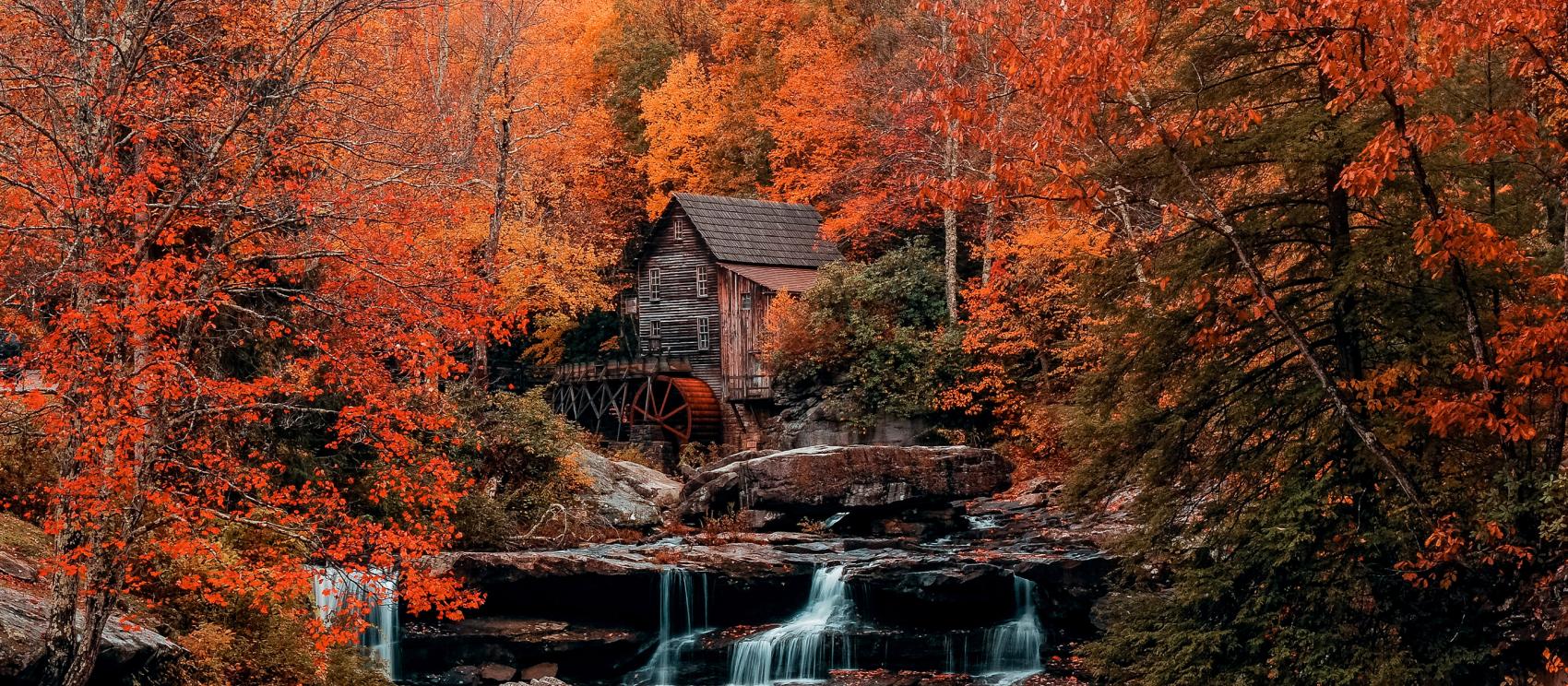 Fall colors ablaze surrounding Glade Creek Grist Mill in Babcock State Park Fall colors ablaze surrounding Glade Creek Grist Mill in Babcock State Park
