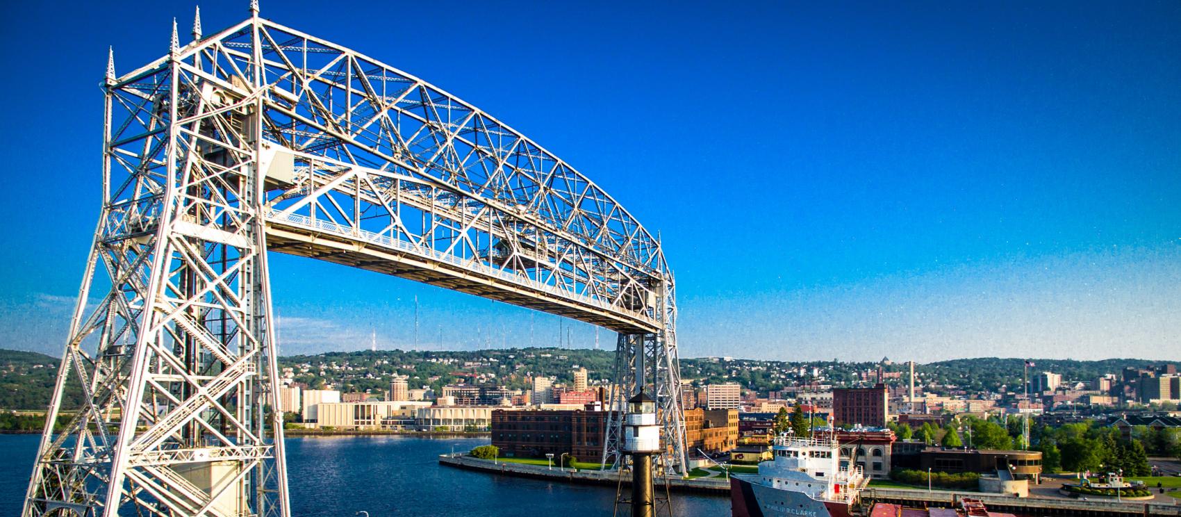 Ship passing through the Aerial Lift Bridge connecting Lake Superior to Duluth 