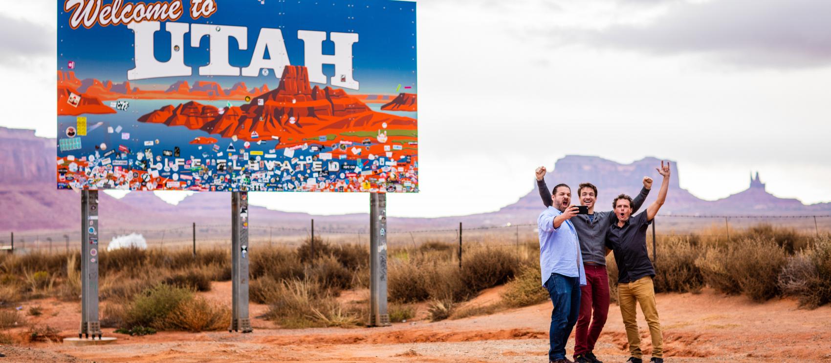 Posing for a photo framed by the incredible formations of Monument Valley