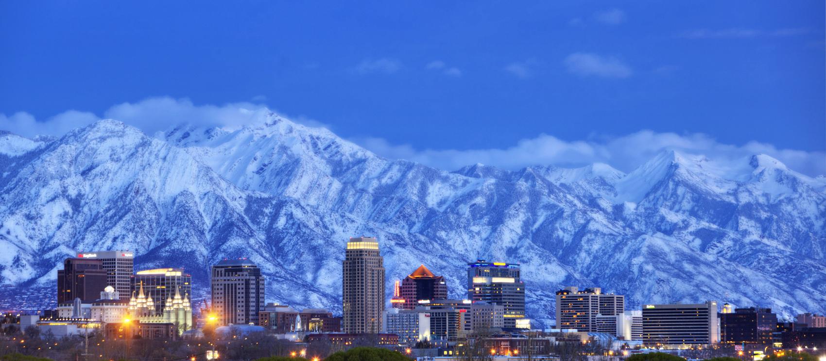 The Salt Lake City skyline and the snow-covered Wasatch Mountains