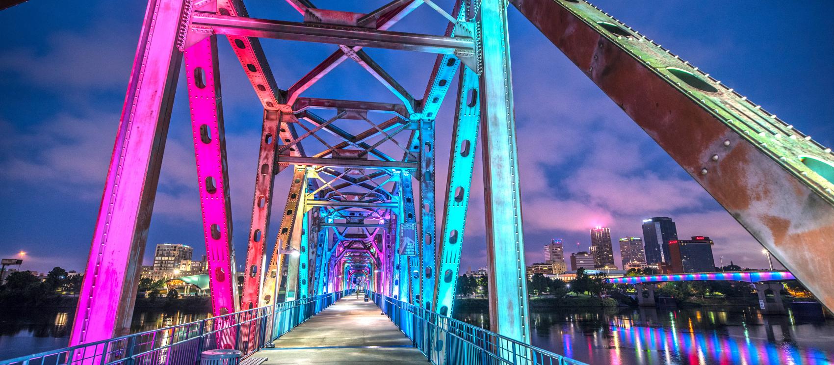The rainbow-colored lights of Junction Bridge, a pedestrian and bicycle pathway in Little Rock The rainbow-colored lights of Junction Bridge, a pedestrian and bicycle pathway in Little Rock