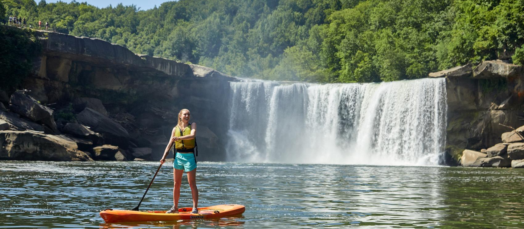 A stand-up paddle boarding tour alongside thundering Cumberland Falls