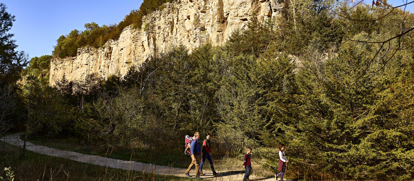 Hiking past limestone bluffs at the Mines of Spain Recreation Area in Dubuque